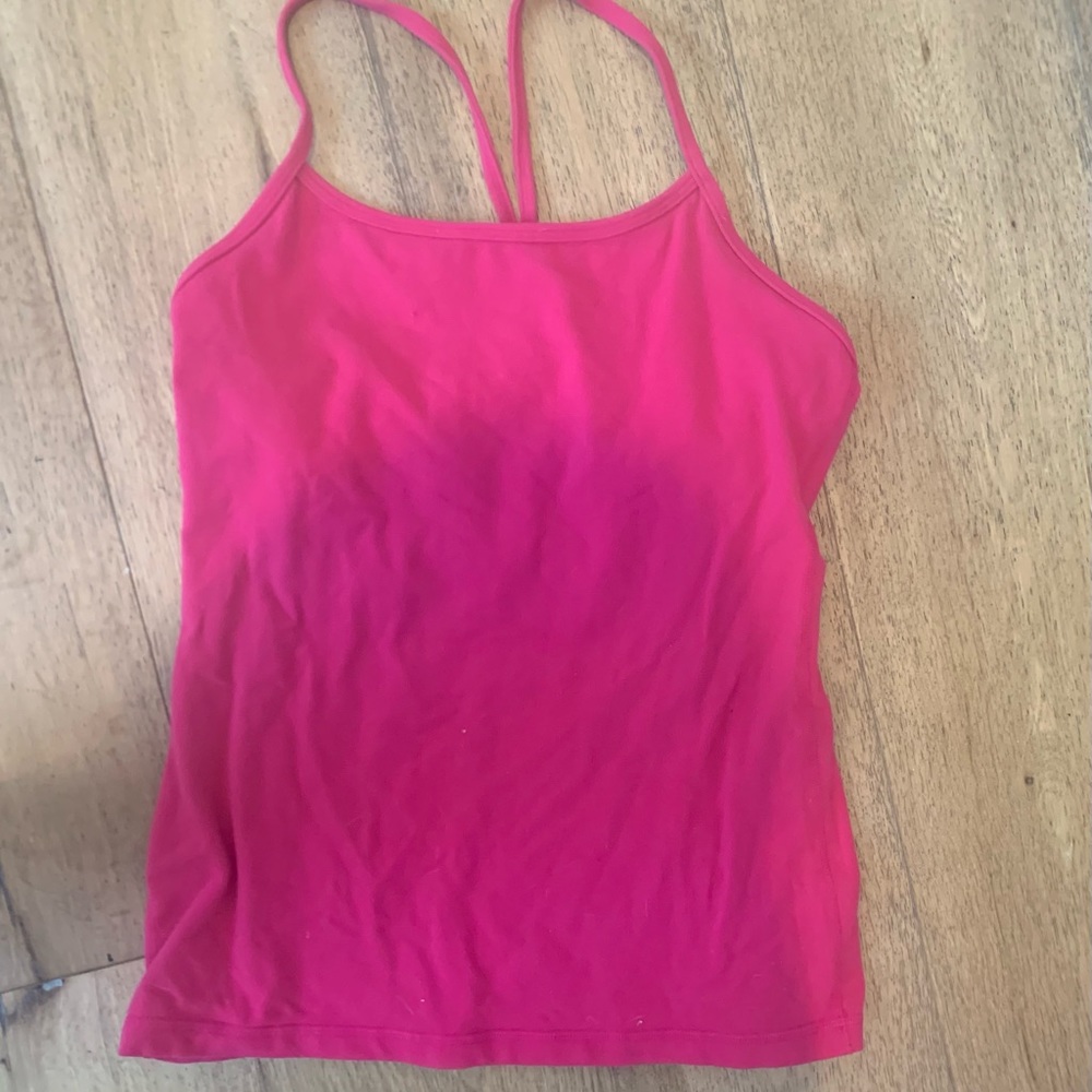 This is a hot pink lululemon tank top with a built in bra that is a size 6.